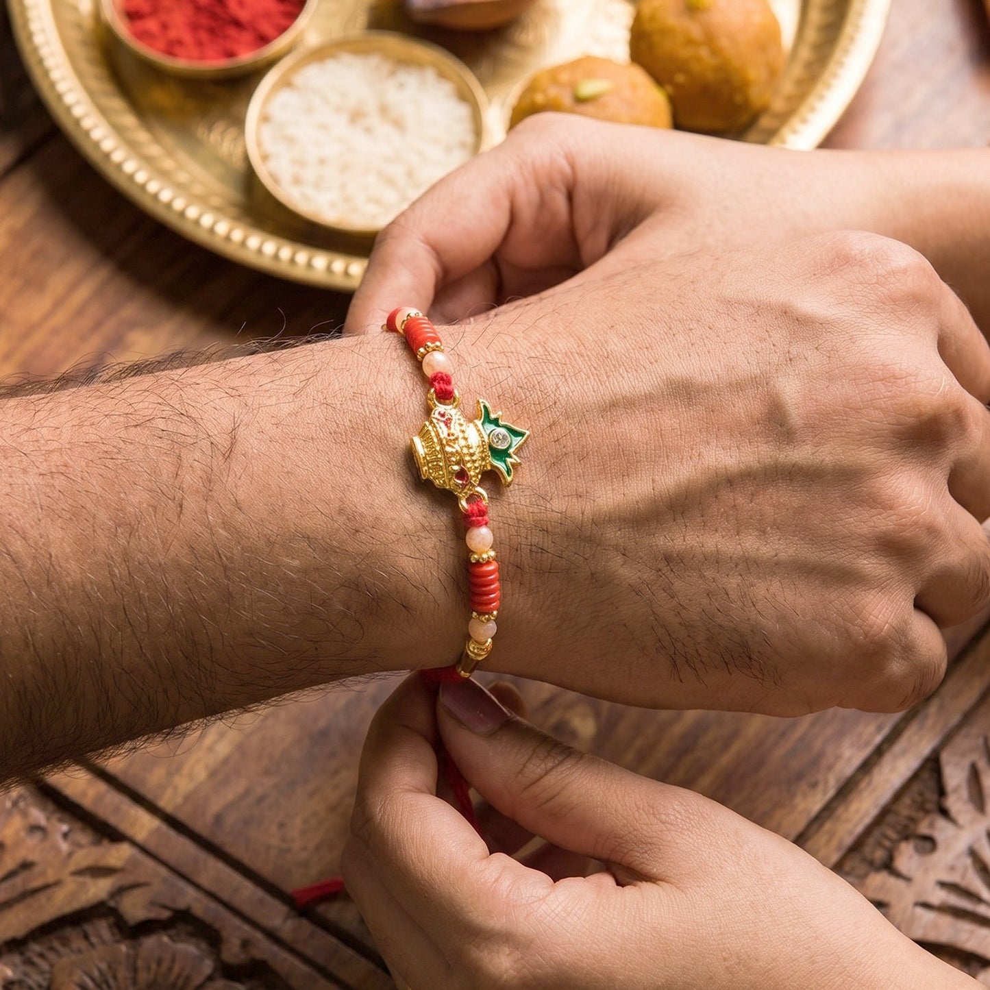 Traditional Rakhi with elegant centerpiece and beads