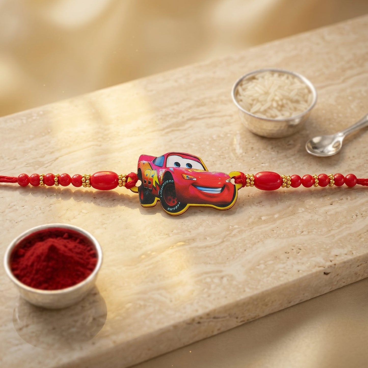 Kids Rakhi with playful red racing car design for boys.