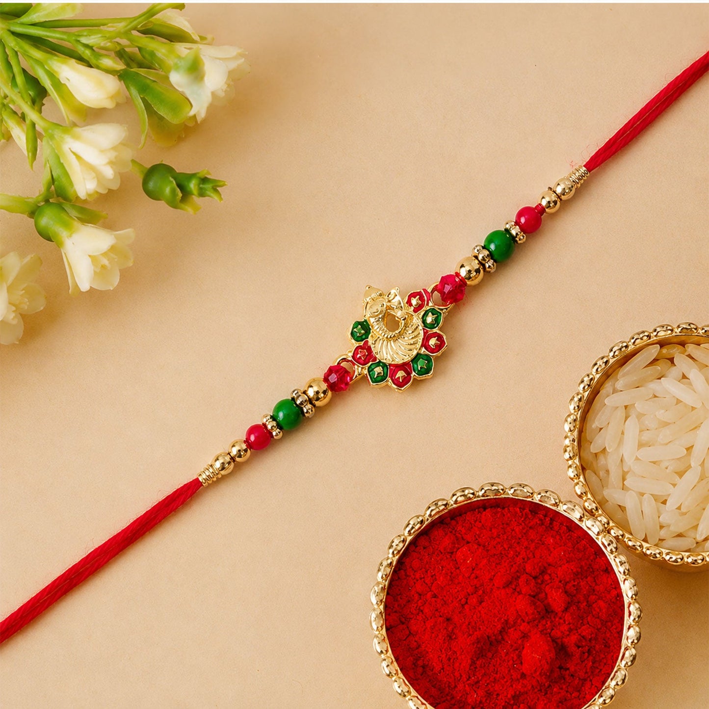 Side perspective highlighting bead and stone craftsmanship on Ganesha Rakhi