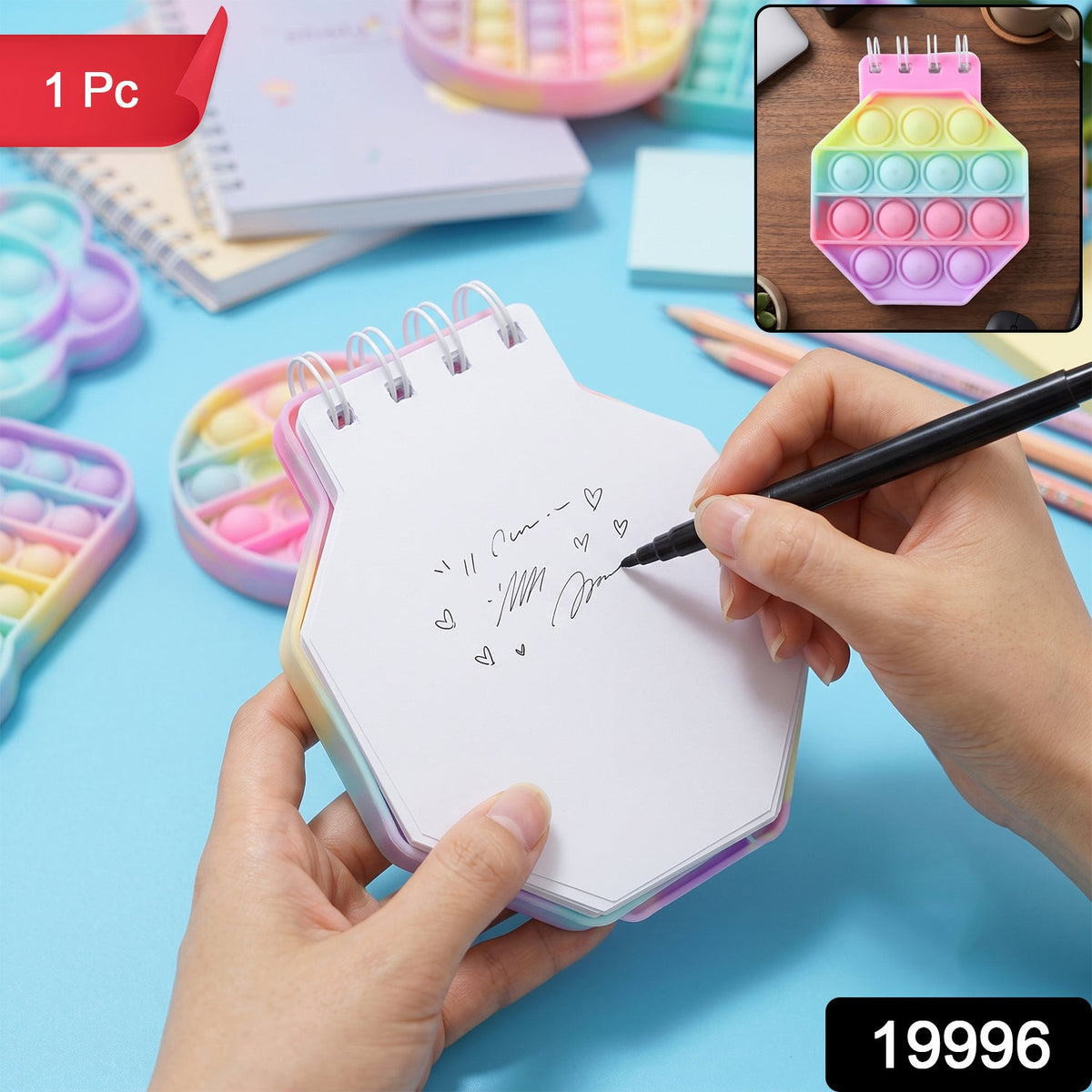 A person's hands writing on a pastel hexagon pop it fidget notebook with a black pen, with a '1 Pc' label.