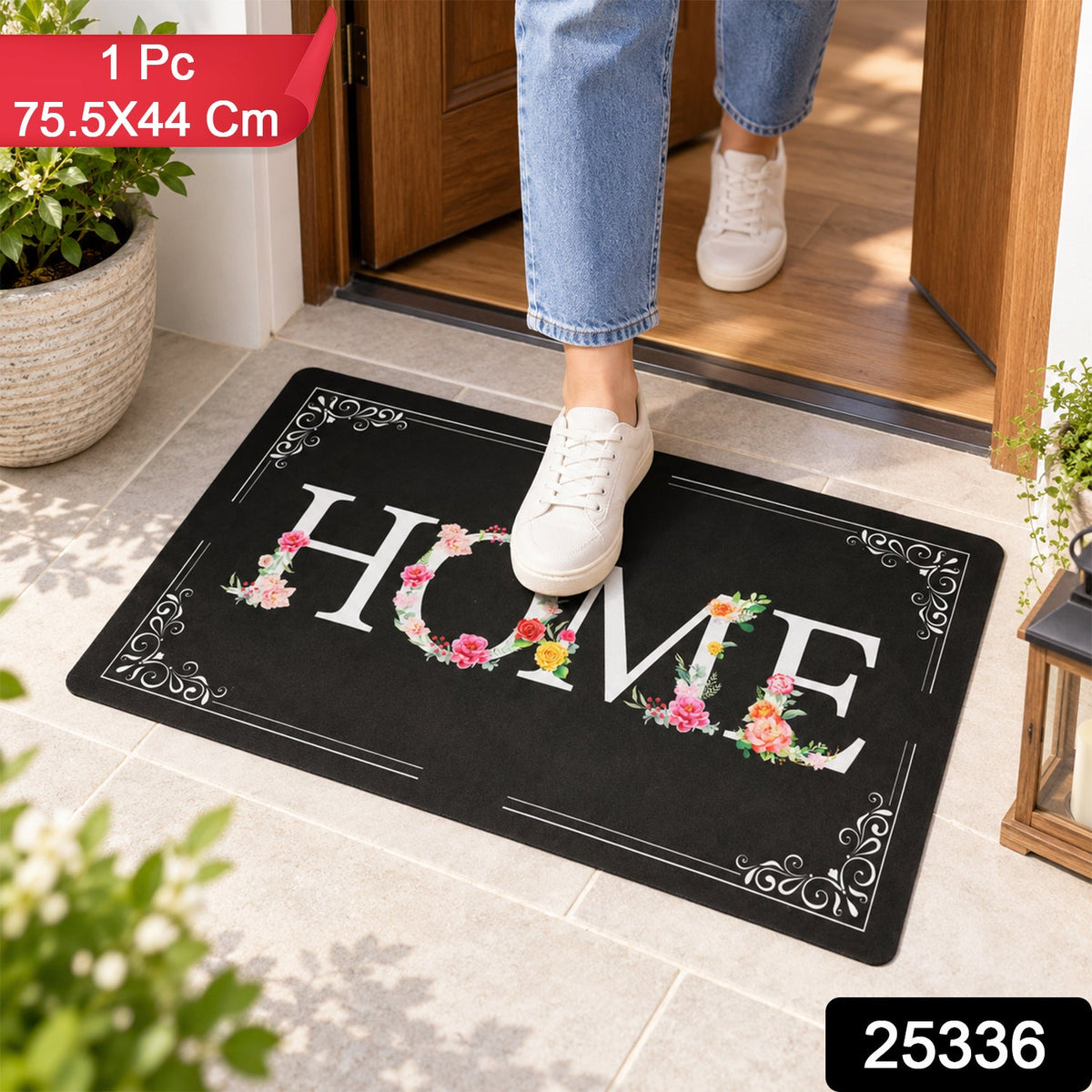 A person steps on a black rectangular mat with a white and floral HOME design at an entryway, with product details overlayed.