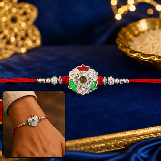 Green white flower rakhi with silver beads on red thread