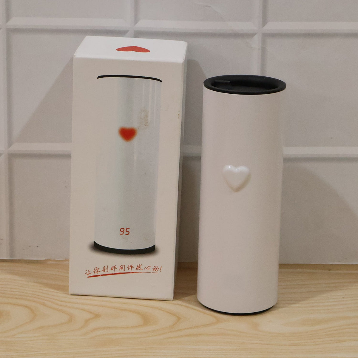 Close-up of stainless steel travel tumbler showing compact size and sturdy build