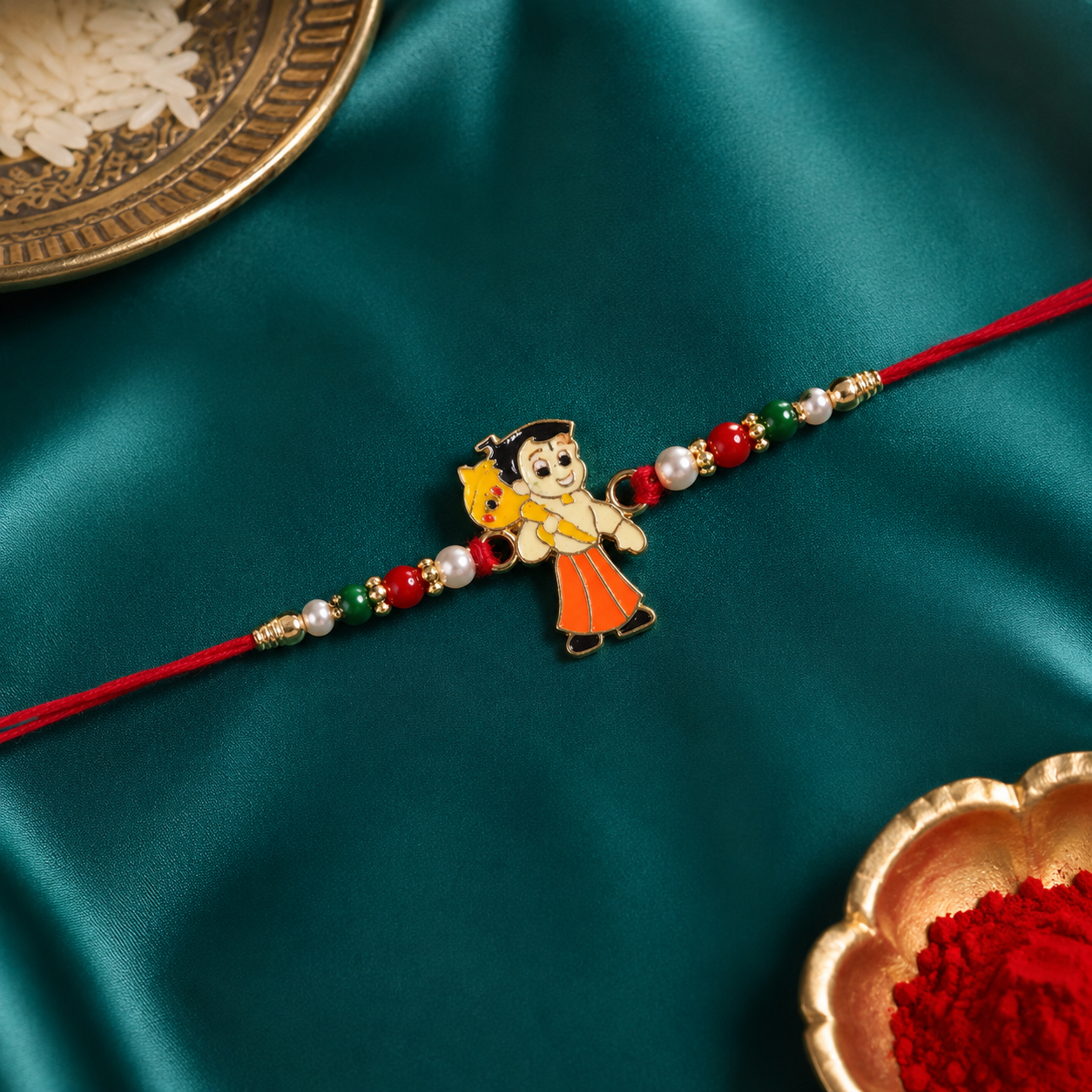 Detailed view of decorative green and red beads on Raksha Bandhan rakhi.