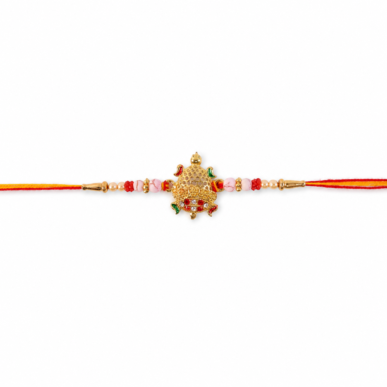 Gold Turtle Rakhi with red thread and decorative elements