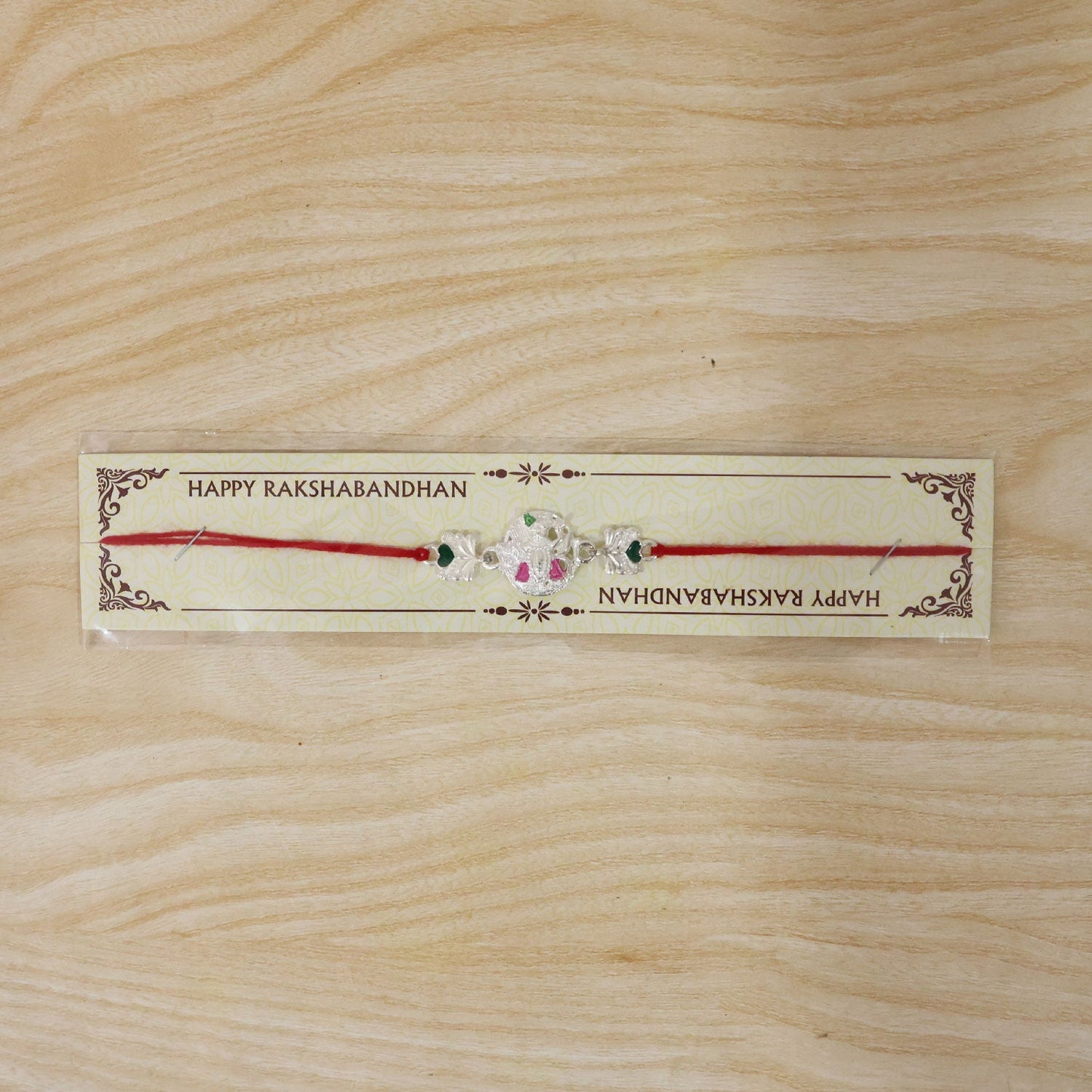 Gifting packaging of Silver Shrinathji Rakhi, ready for celebration
