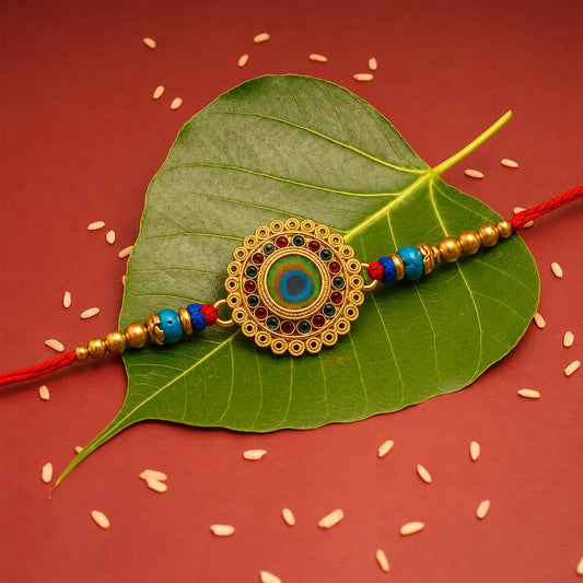 Golden flower Rakhi with colorful stones for Raksha Bandhan