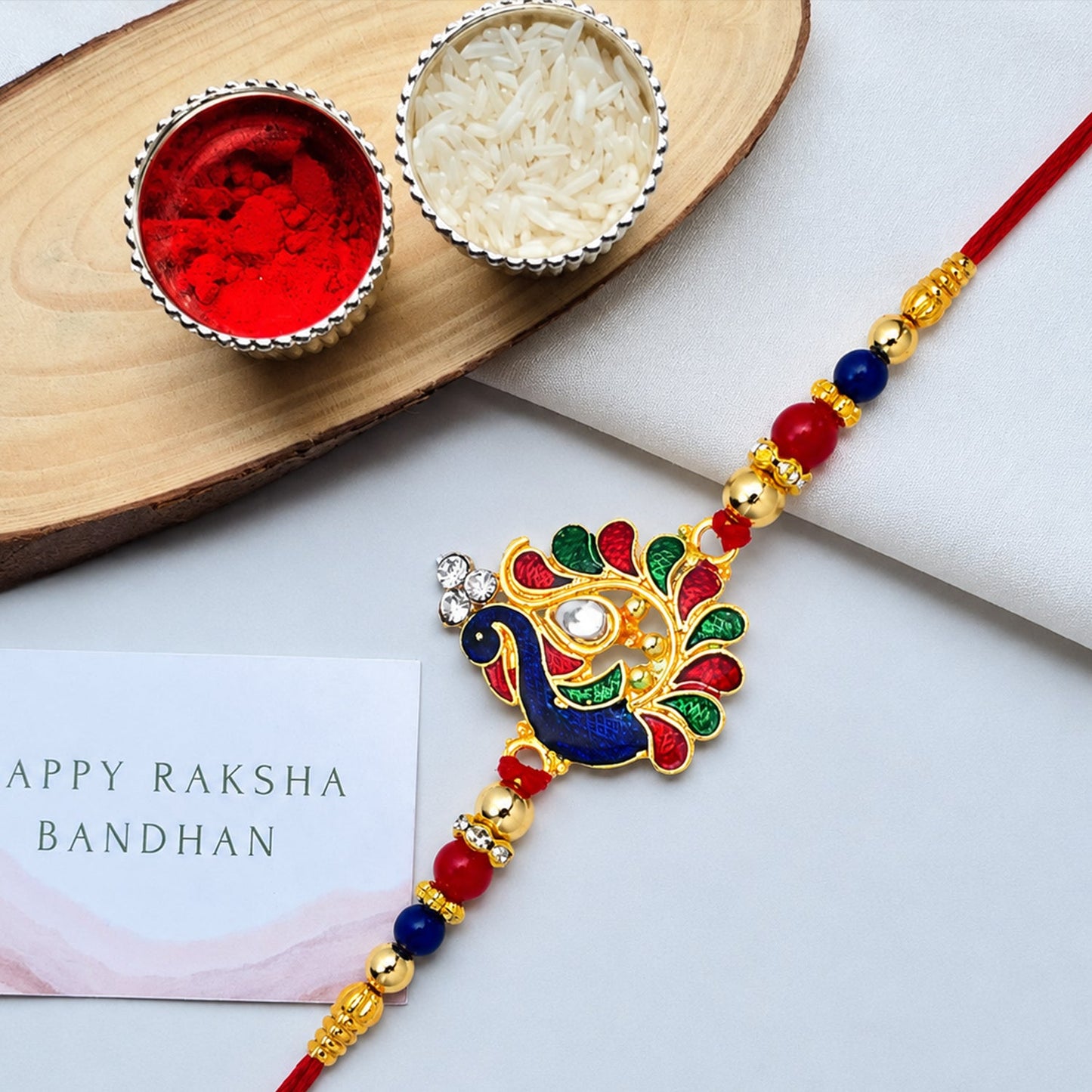 Elegant traditional peacock Rakhi with detailed craftsmanship