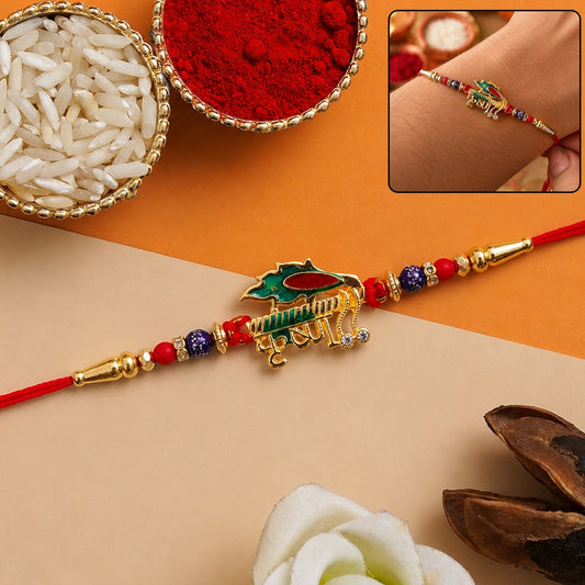 Close-up of the stylish designer Rakhi with red and blue beads for brother