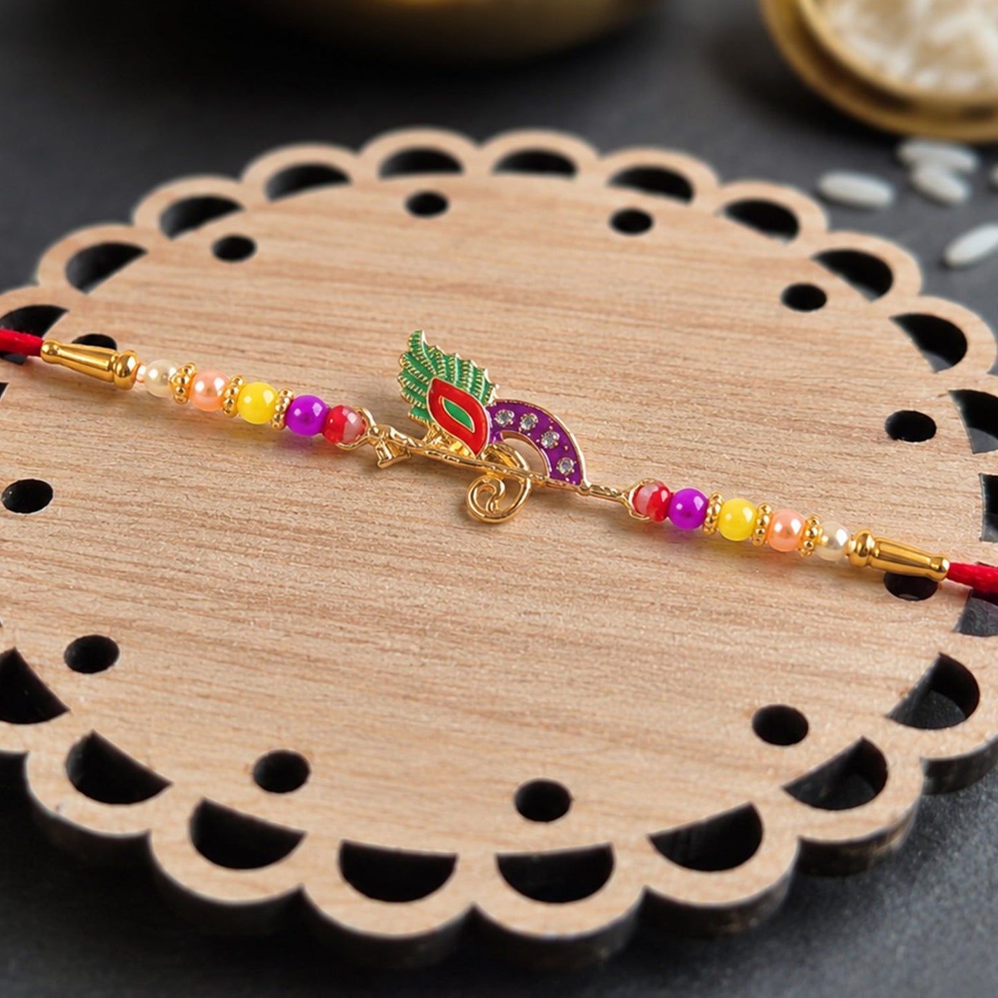 Traditional bird design Rakhi with colorful beads for brothers