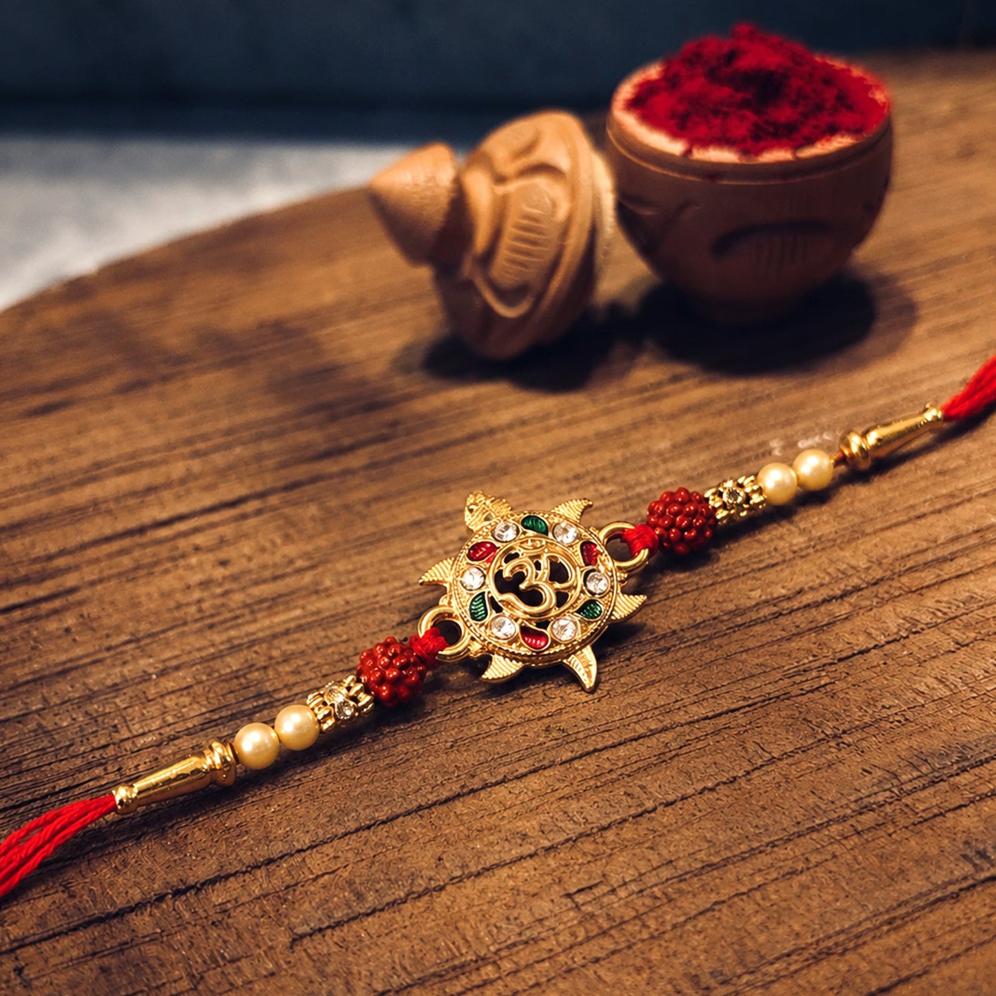 Om symbol designer Rakhi with premium stones for spiritual gifting