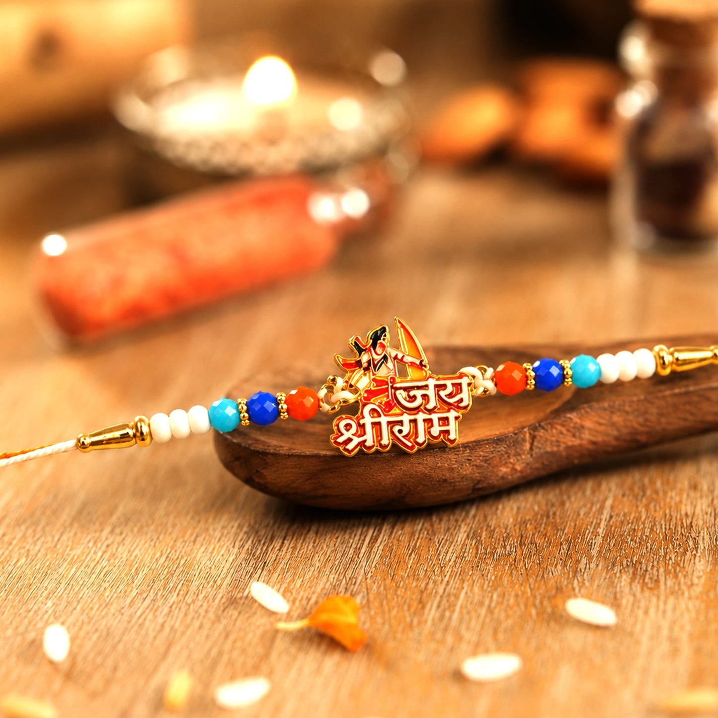 Jai Shri Ram Designer Rakhi with vibrant red and yellow beads