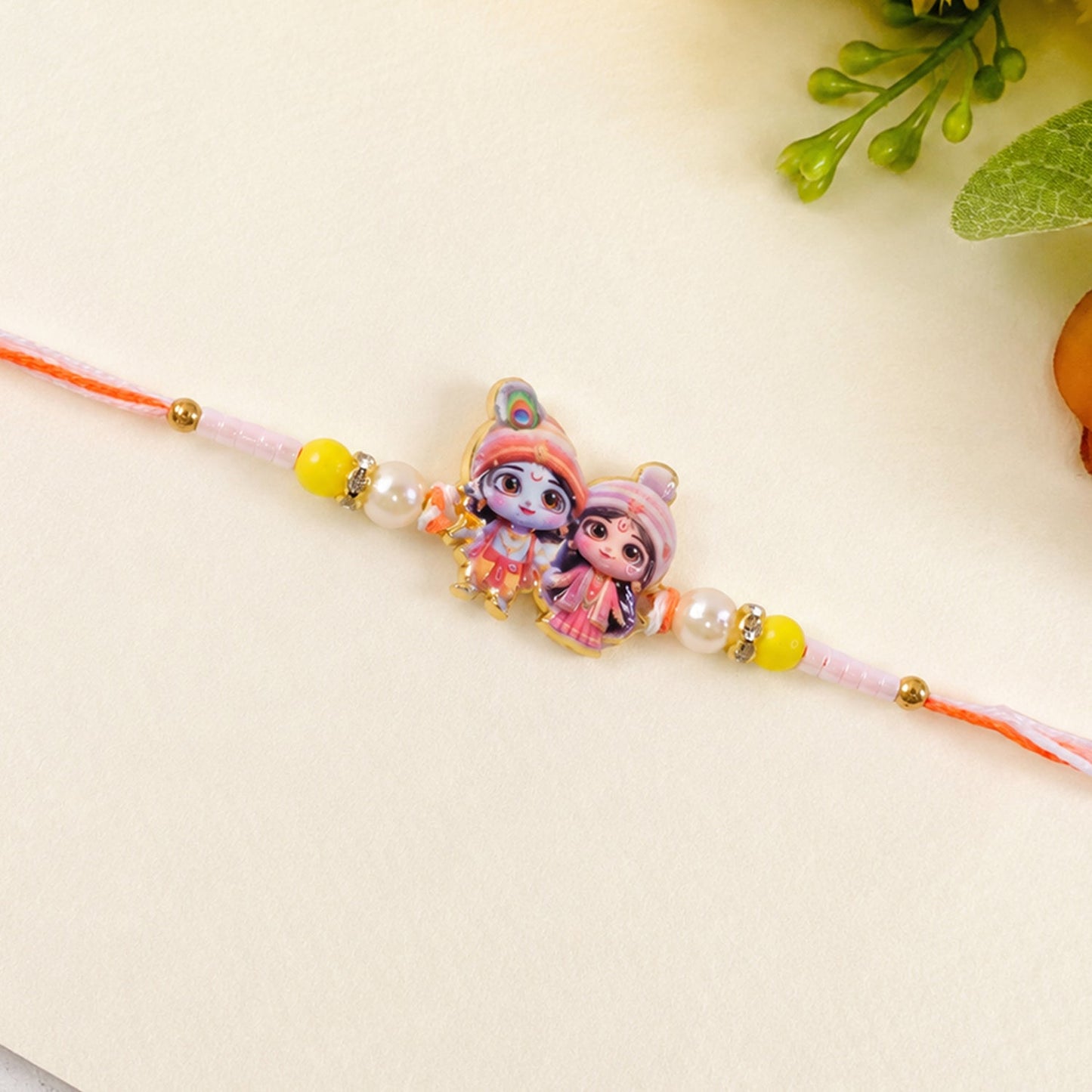 Elegant Lord Krishna and Radha Rakhi with soft thread.