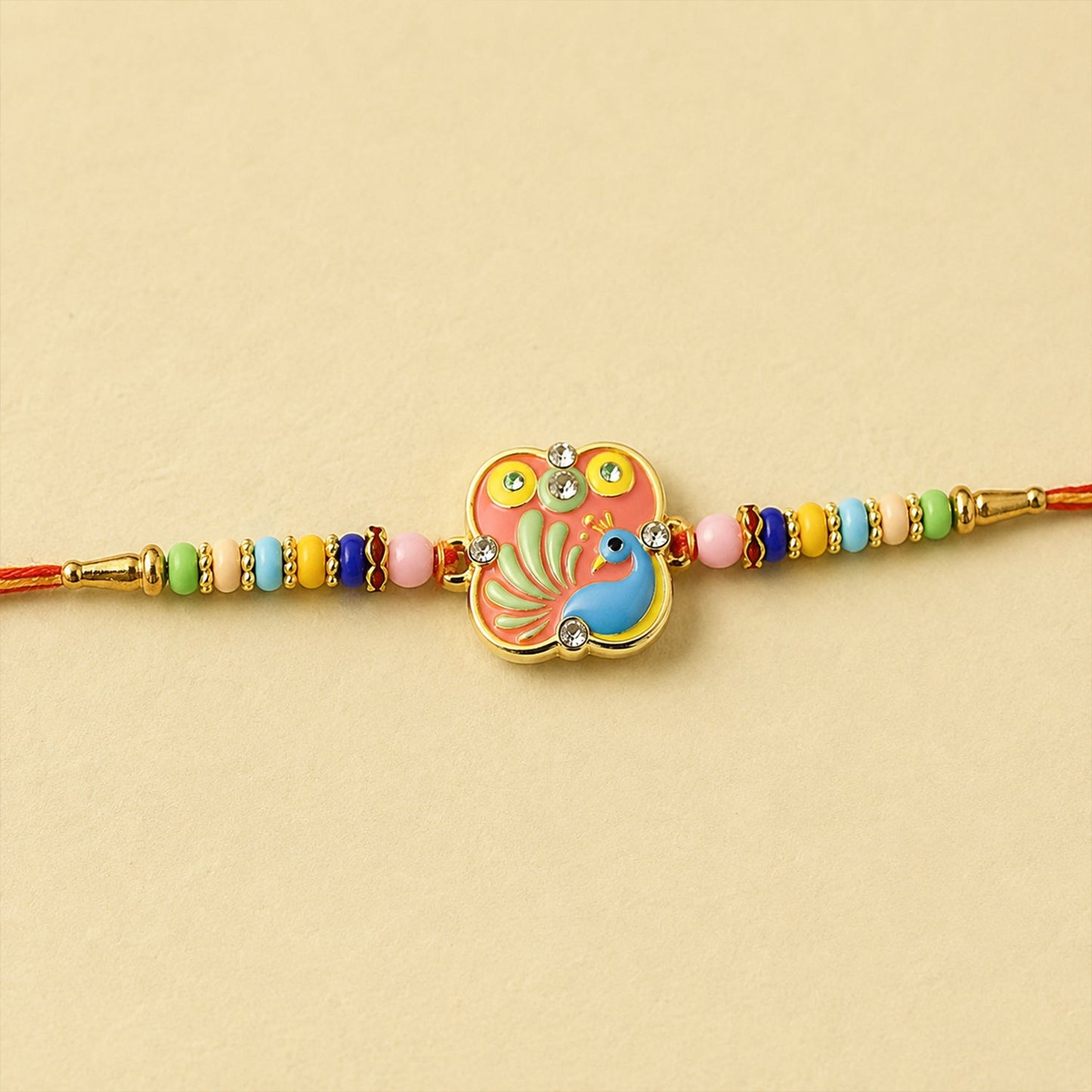 Peacock designer Rakhi with multicolor beads on soft thread, perfect for Raksha Bandhan