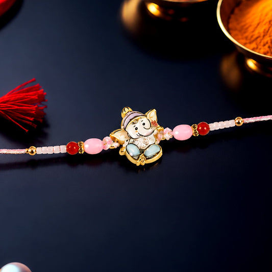 Ganesha designer Rakhi with pink and red beads showcasing festive appeal