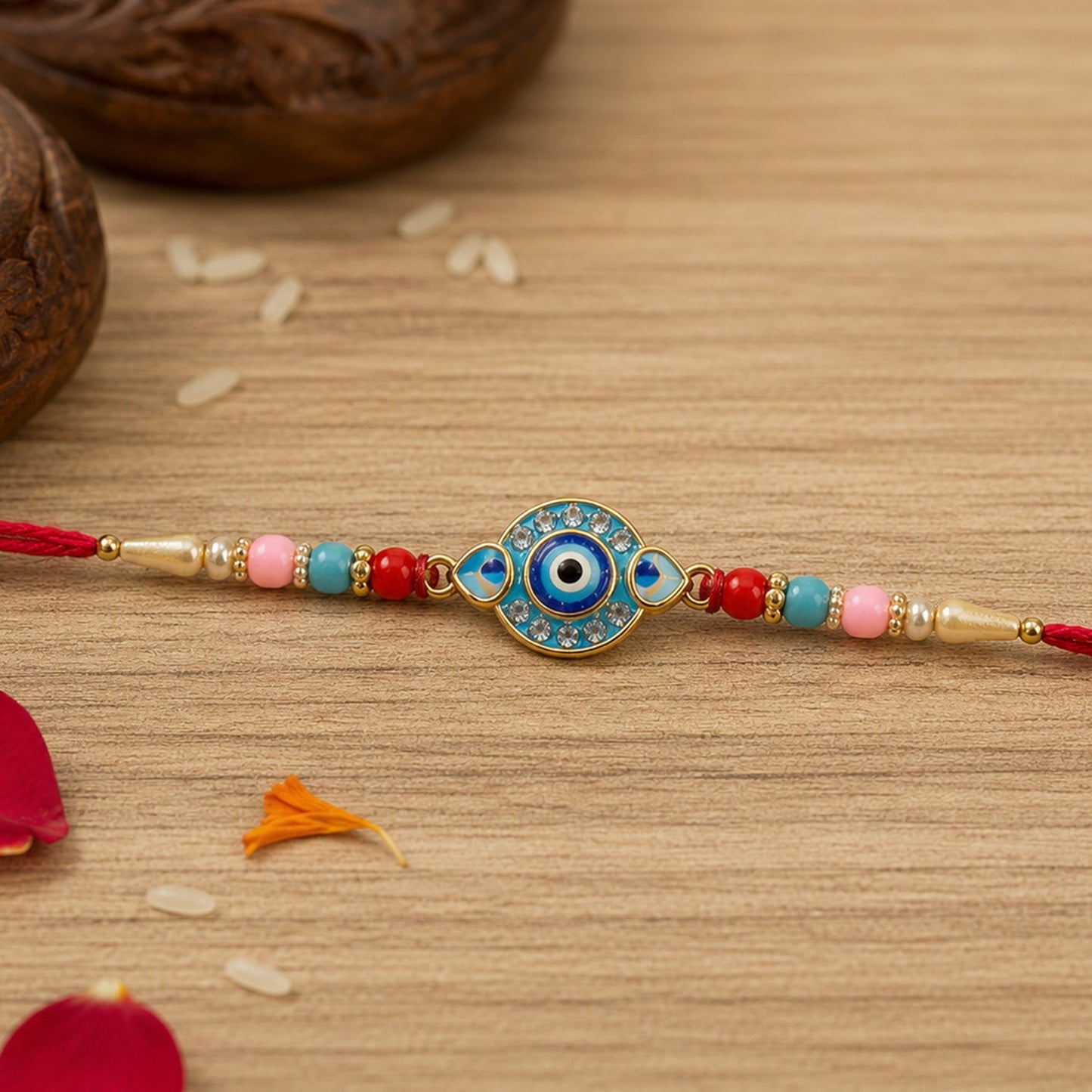 Close-up of an Evil Eye Rakhi featuring bright multicolor beads on soft thread.