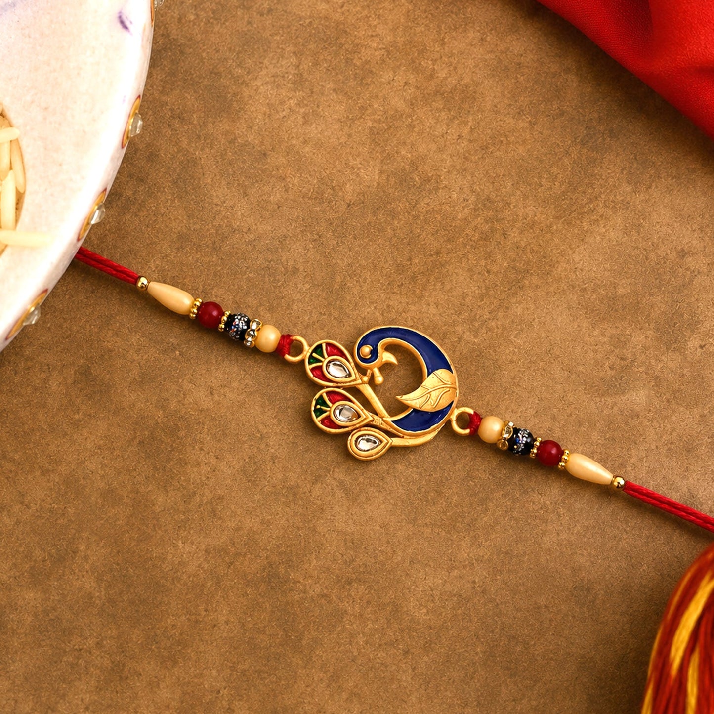 Handcrafted Peacock Meenakari Rakhi for a joyful Raksha Bandhan celebration.