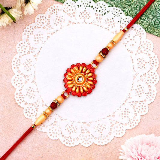 Floral Bead Rakhi with central stone on white background