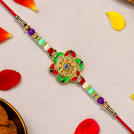 Gold plated floral Rakhi with intricate design, perfect for Raksha Bandhan