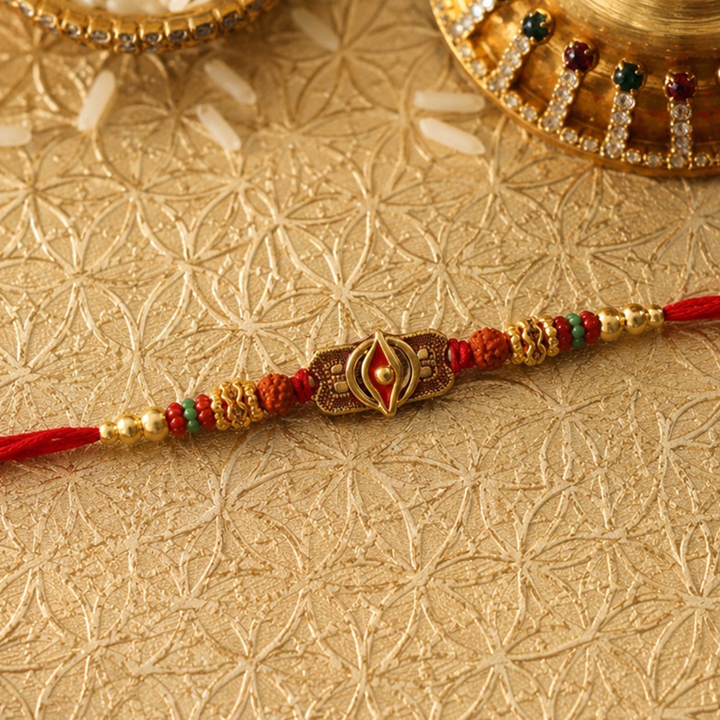 Traditional Rudraksha Rakhi featuring an oxidized centerpiece and decorative beads on a white surface.