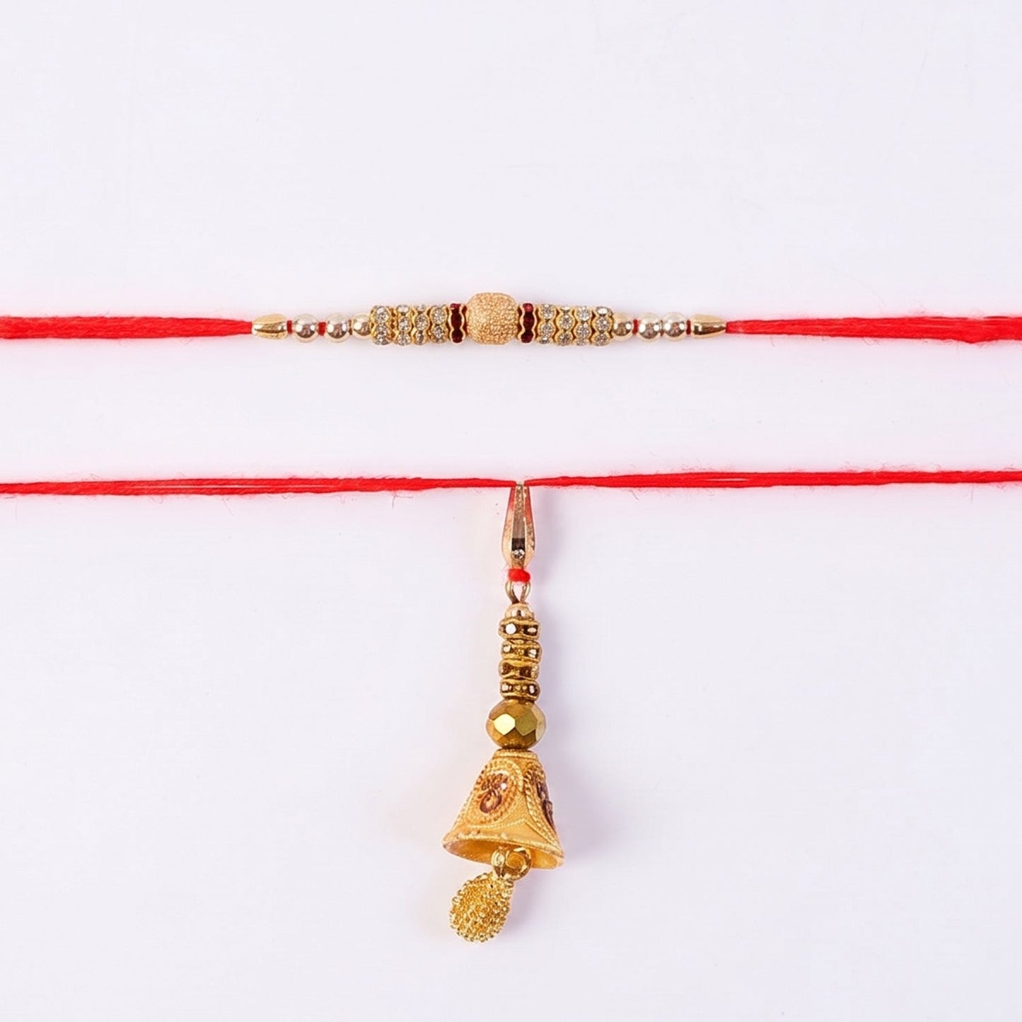 Side view of golden Bhabhi Rakhi with pearl drop latkan