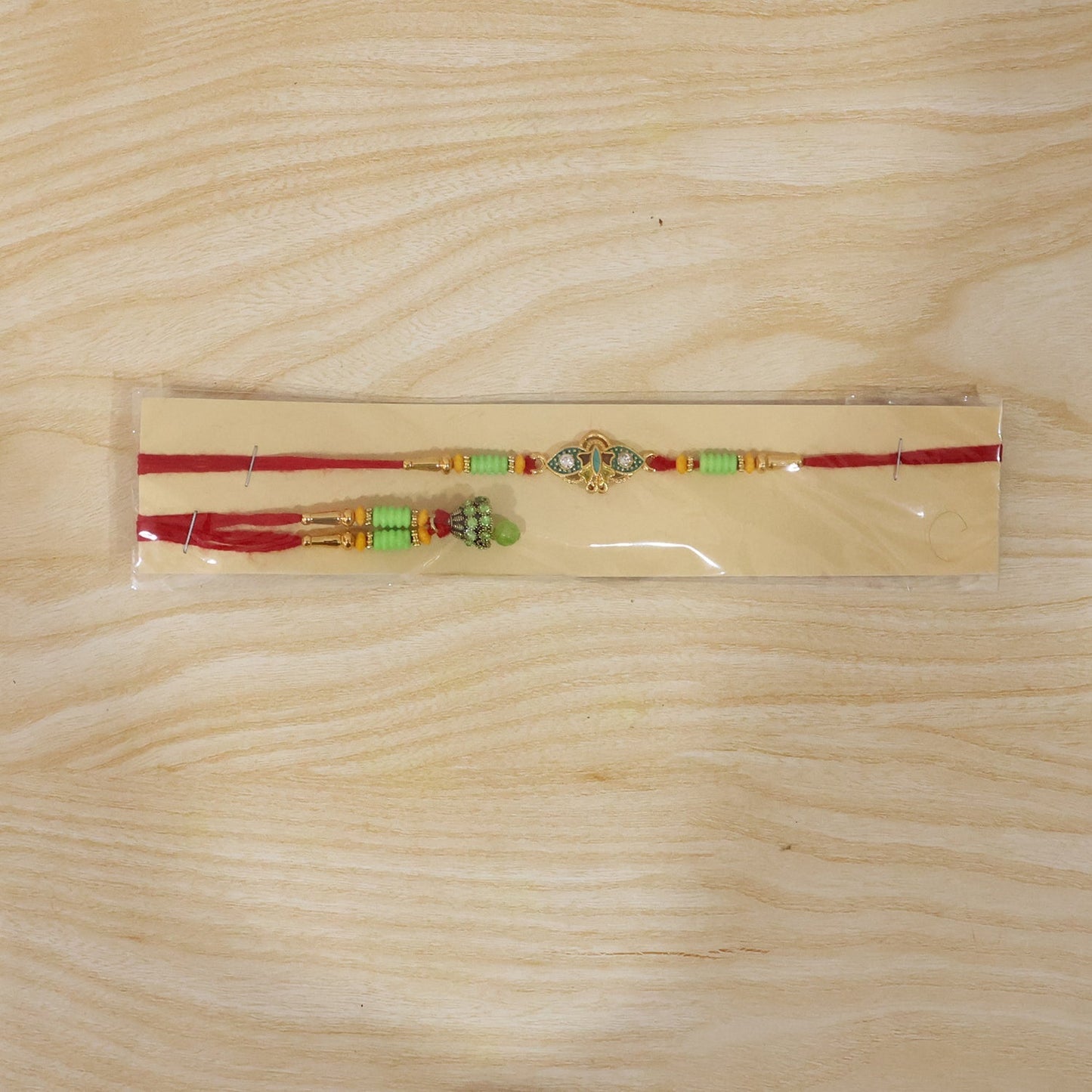 Om Peacock Bhabhi Rakhi displayed on white background
