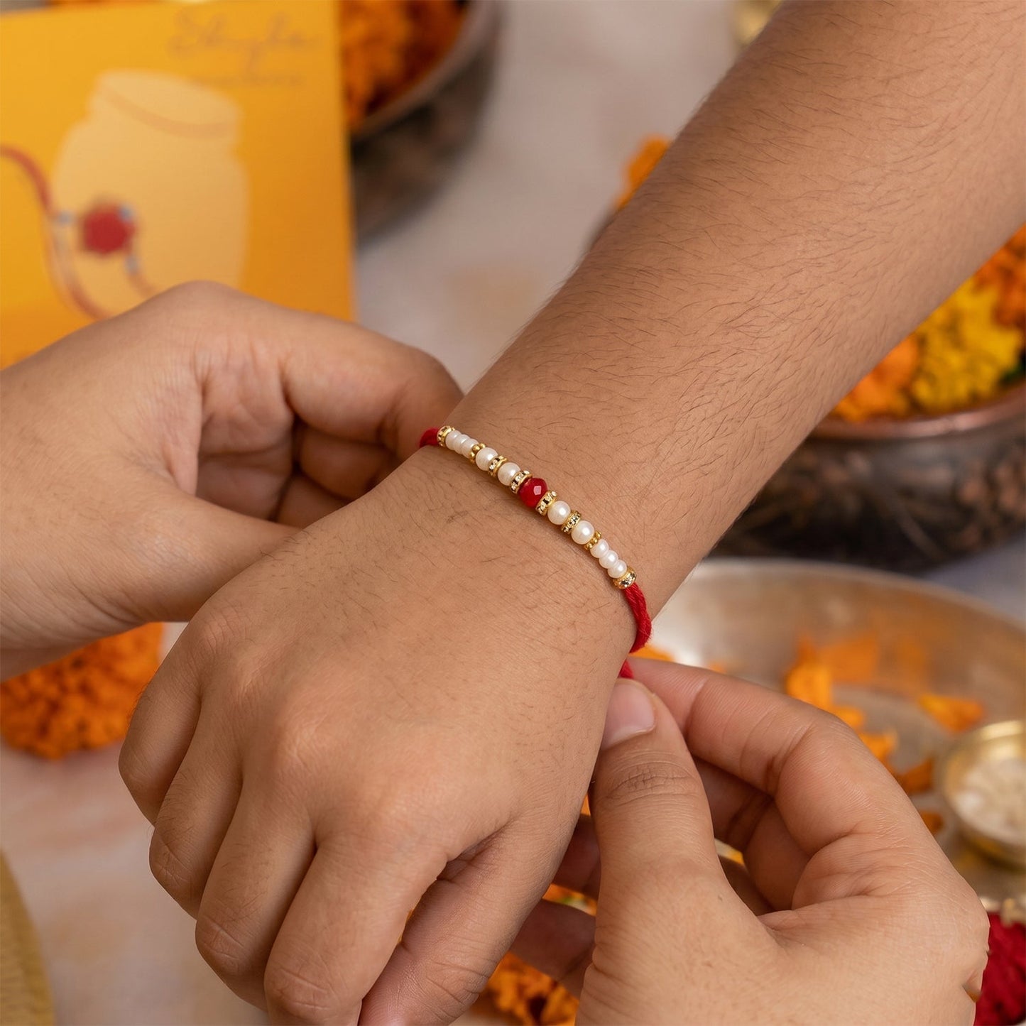 Vibrant Bead Bhabhi Rakhi with elephant motif and latkan