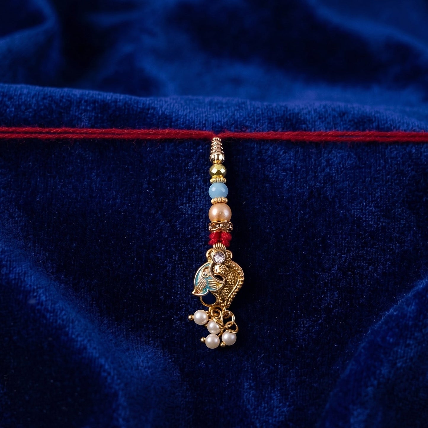 Detailed bead and thread texture on Pearl Bead Bhabhi Rakhi