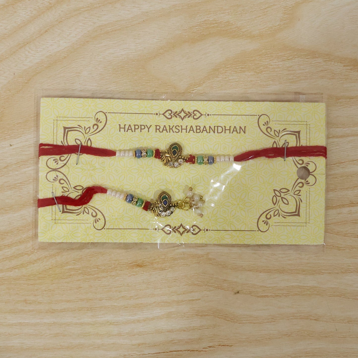 Pearl Cluster Bhabhi Rakhi with peacock charm fully displayed