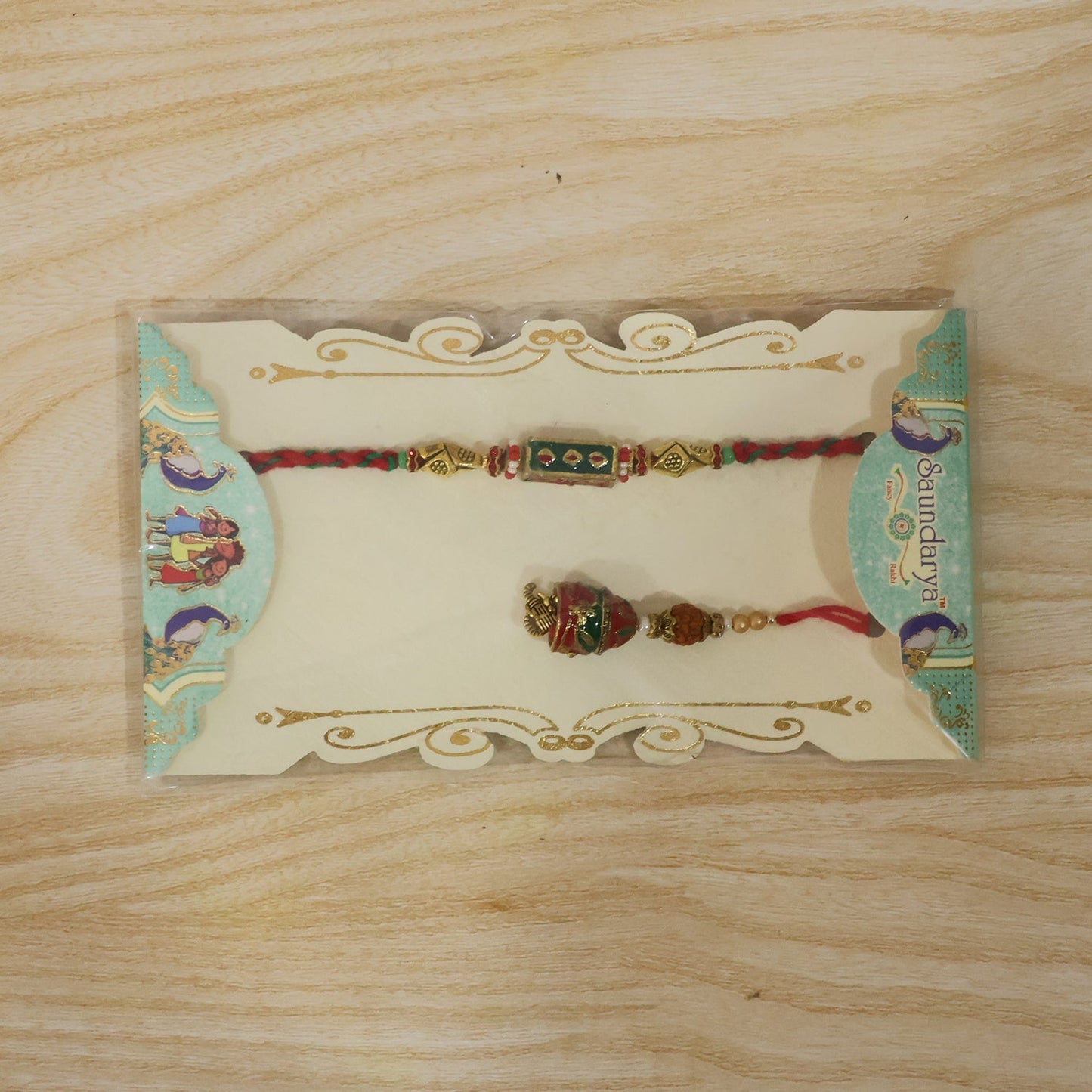 Front view highlighting pearl adornment on Meenakari Rakhi