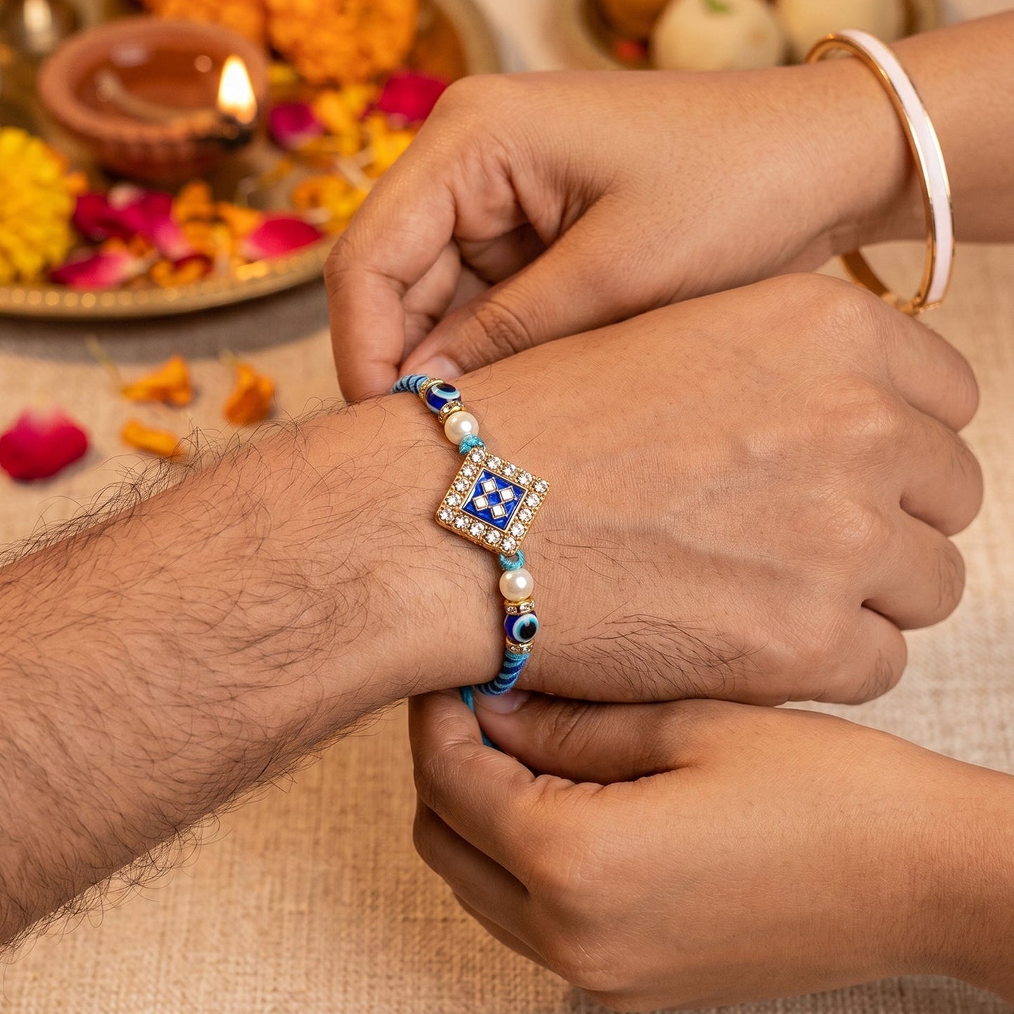 Decorative pearl twin charm and thread on Bhabhi Rakhi