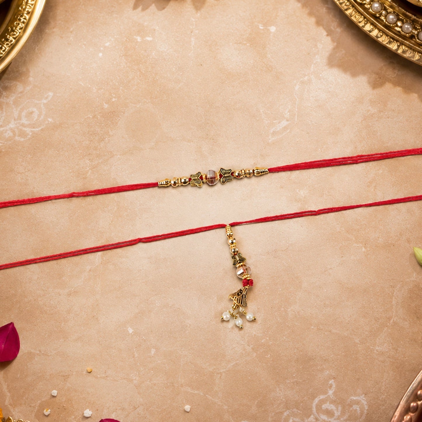 Close-up of gold latkan and stone details of Bhabhi Rakhi