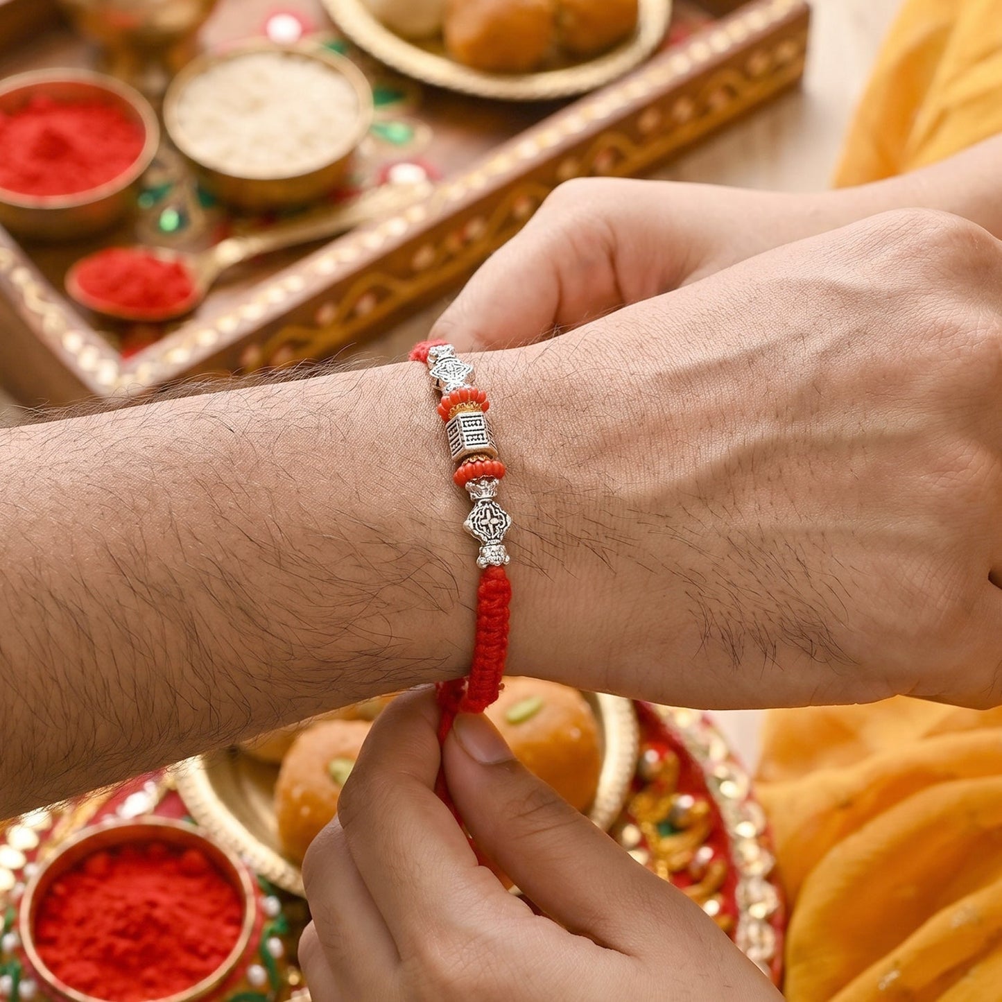 Detail of leaf charm on Bhabhi Rakhi with beads