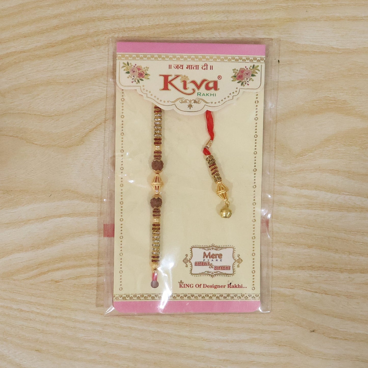 Close-up of gold latkan on pearl bead Rakhi