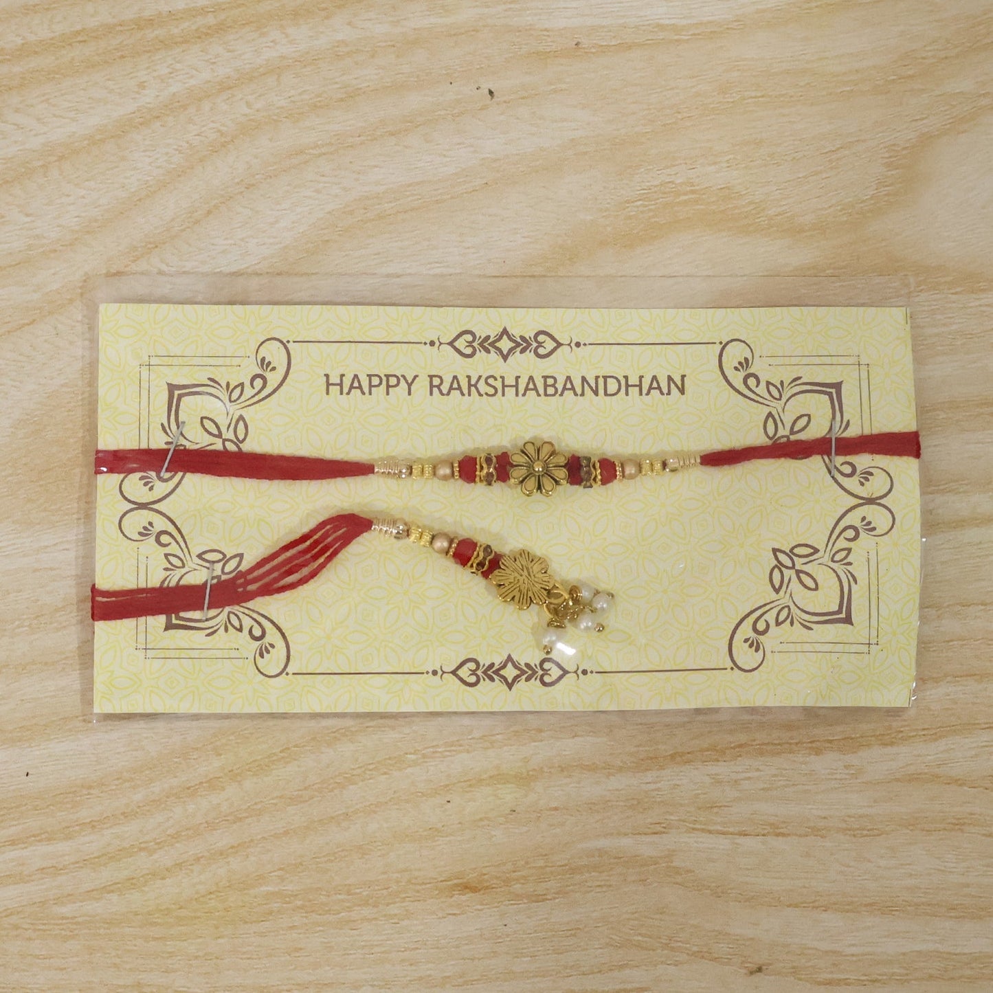 Close-up of pearl and floral elements on Bhabhi Rakhi