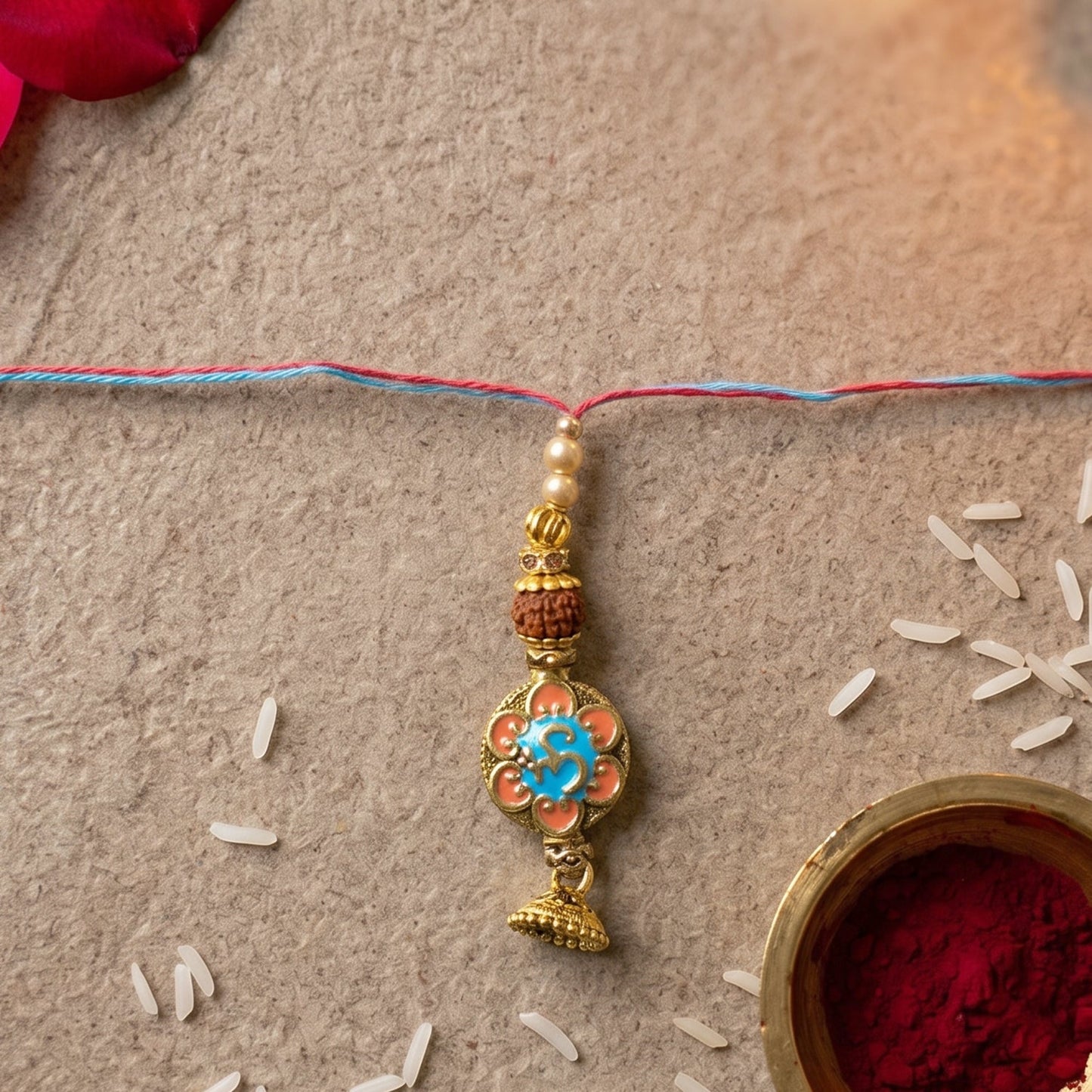 Pearl Latkan hanging from the Peacock Stone Bhabhi Rakhi for elegant look