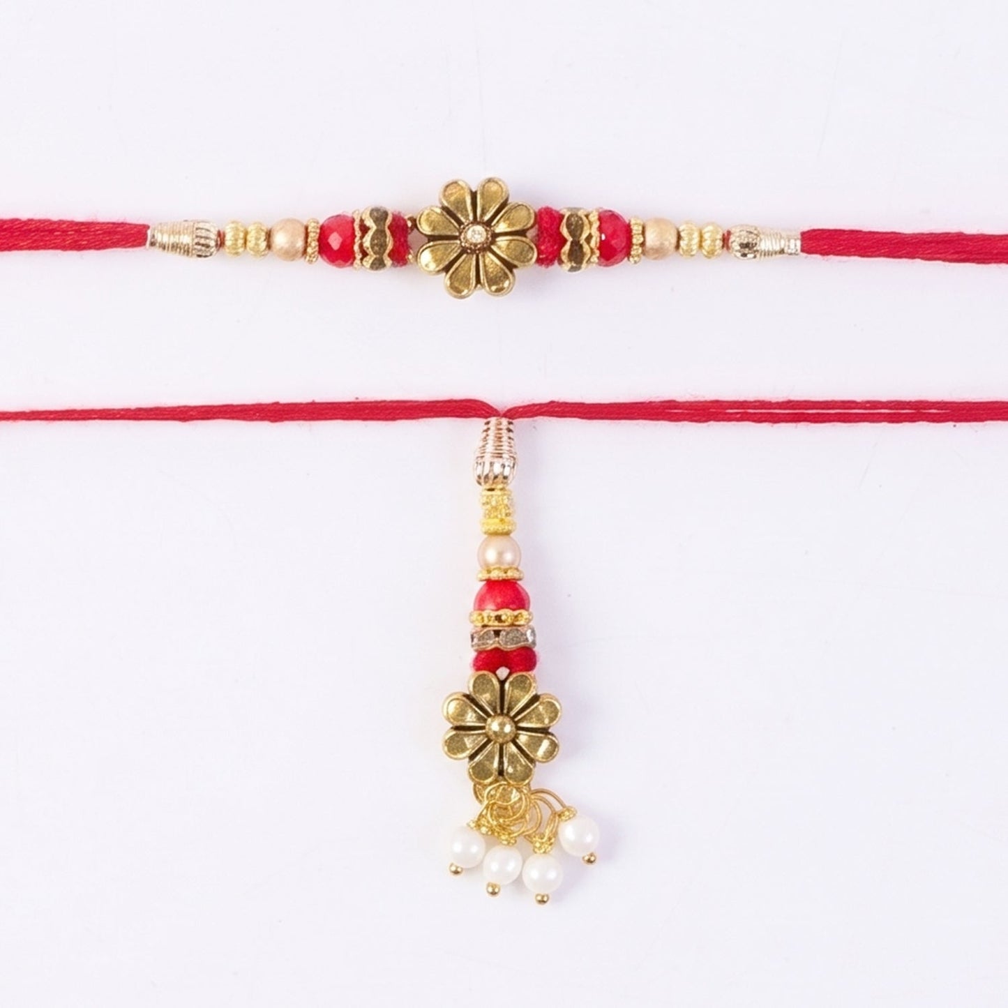 Golden floral Rakhi with hanging pearl beads and peacock latkan