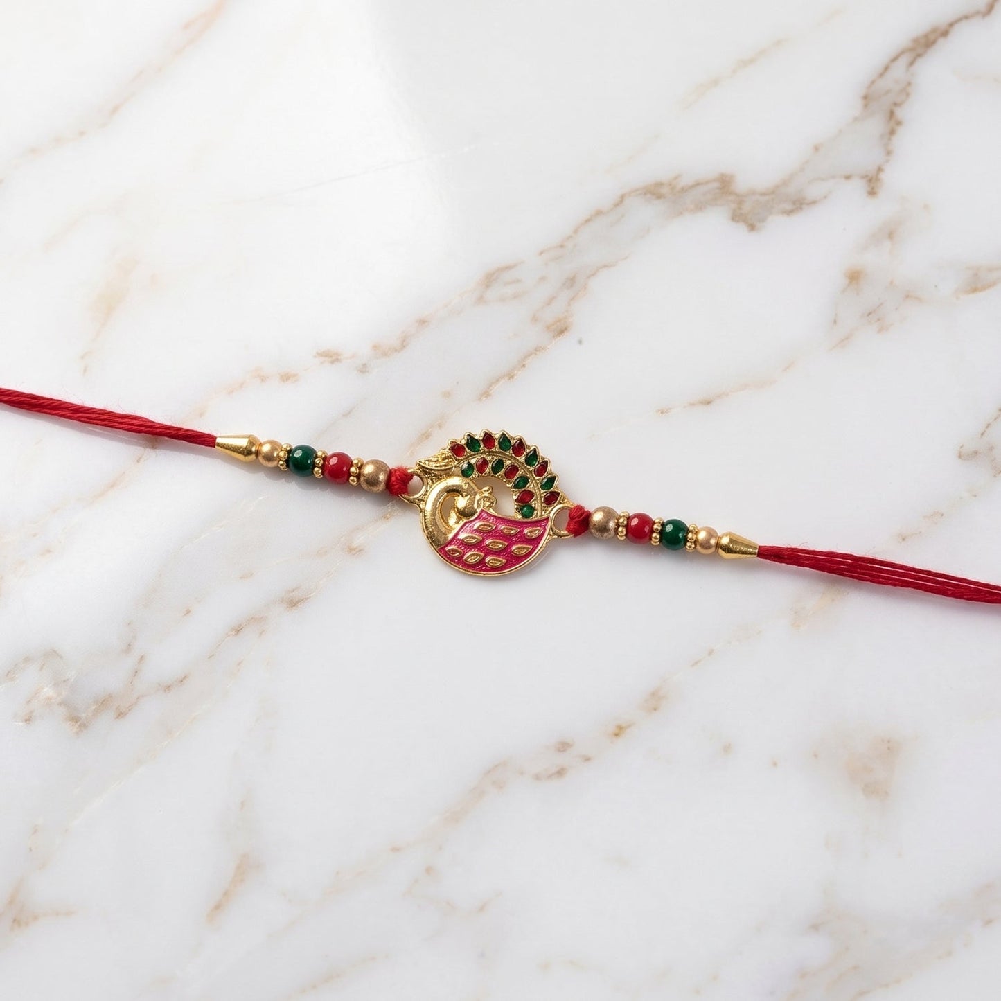 Pink Peacock Rakhi with soft thread detail