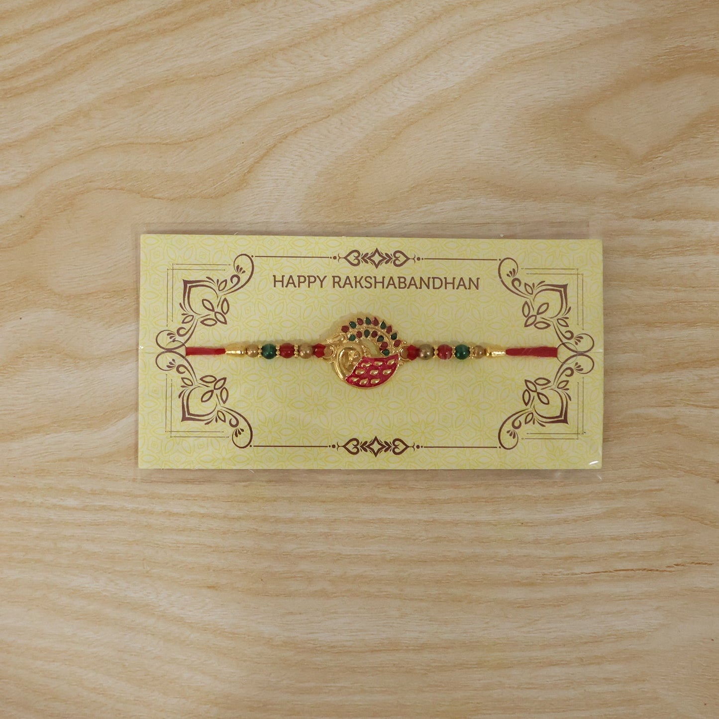 Styled Pink Peacock Rakhi for Raksha Bandhan celebration