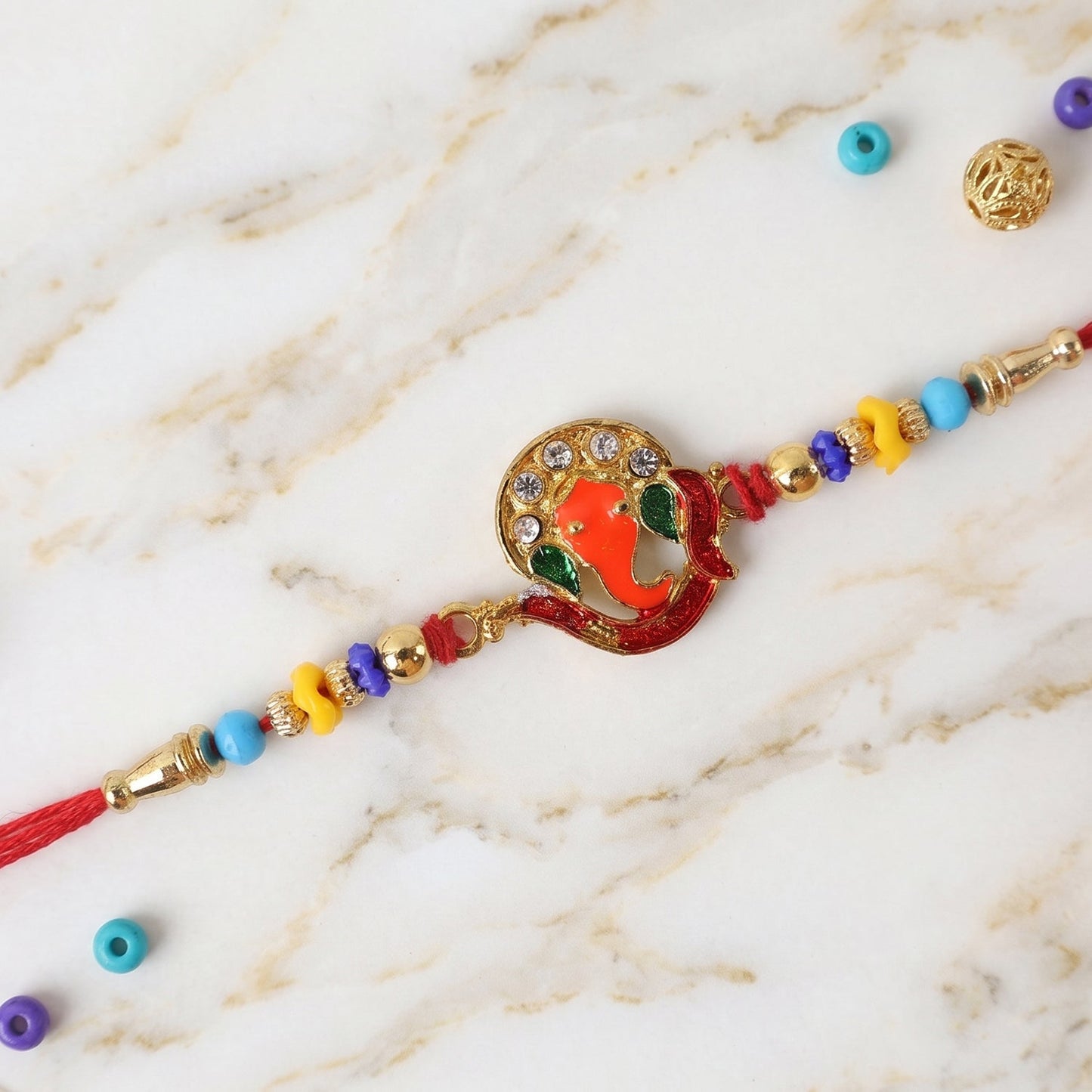 Side view of Ganesh Rakhi with beads