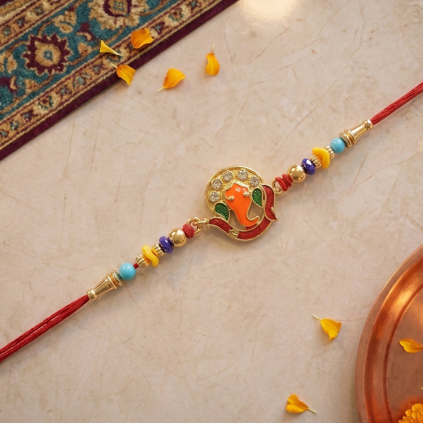 Traditional decorative beads on Rakhi thread with Ganesh motif
