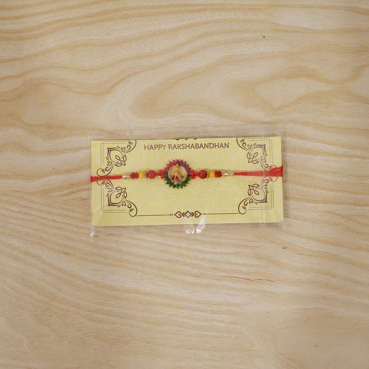 Festive circular Rakhi with beads ready for celebration