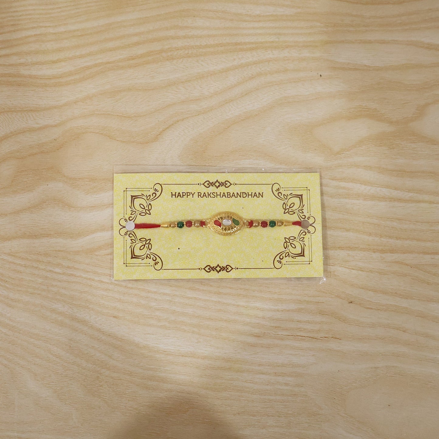 Elegant golden and beaded Rakhi for Raksha Bandhan festival