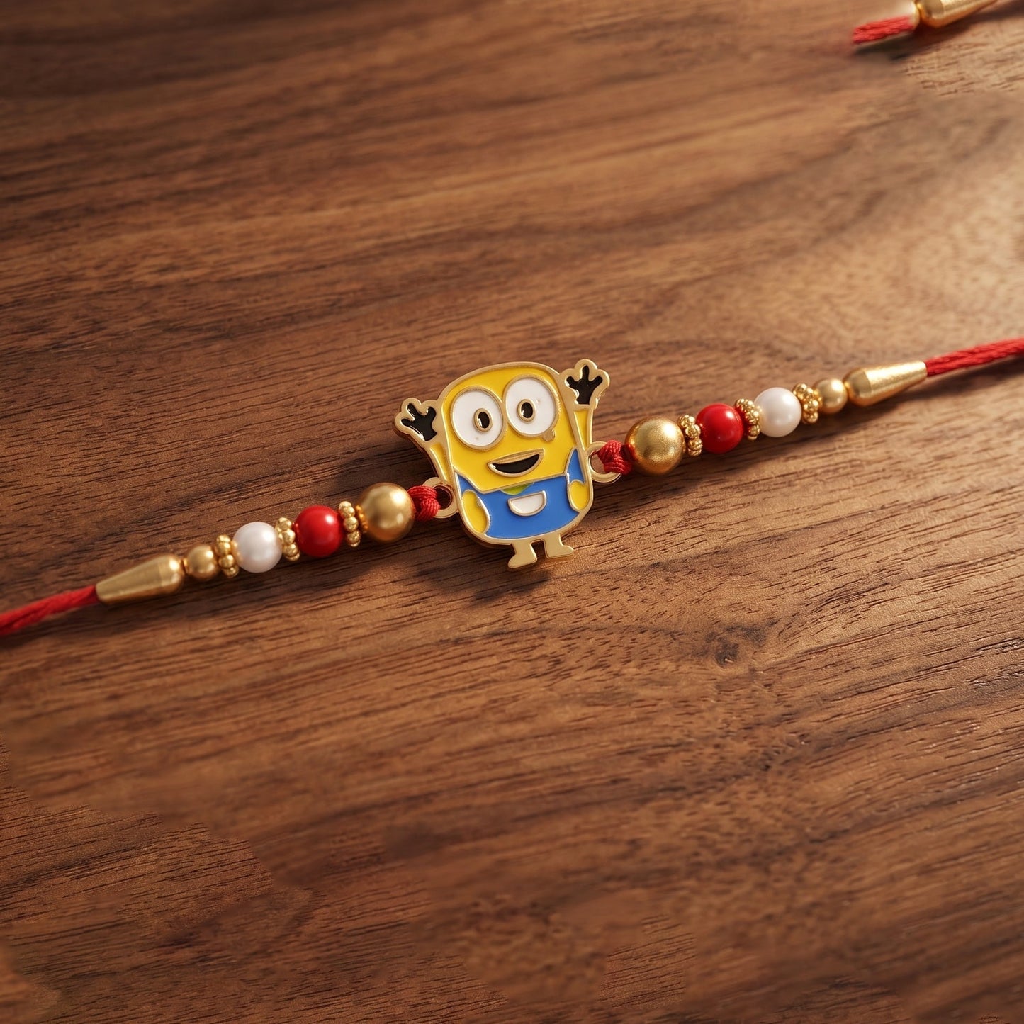 Traditional Rakhi with cartoon character and decorative thread