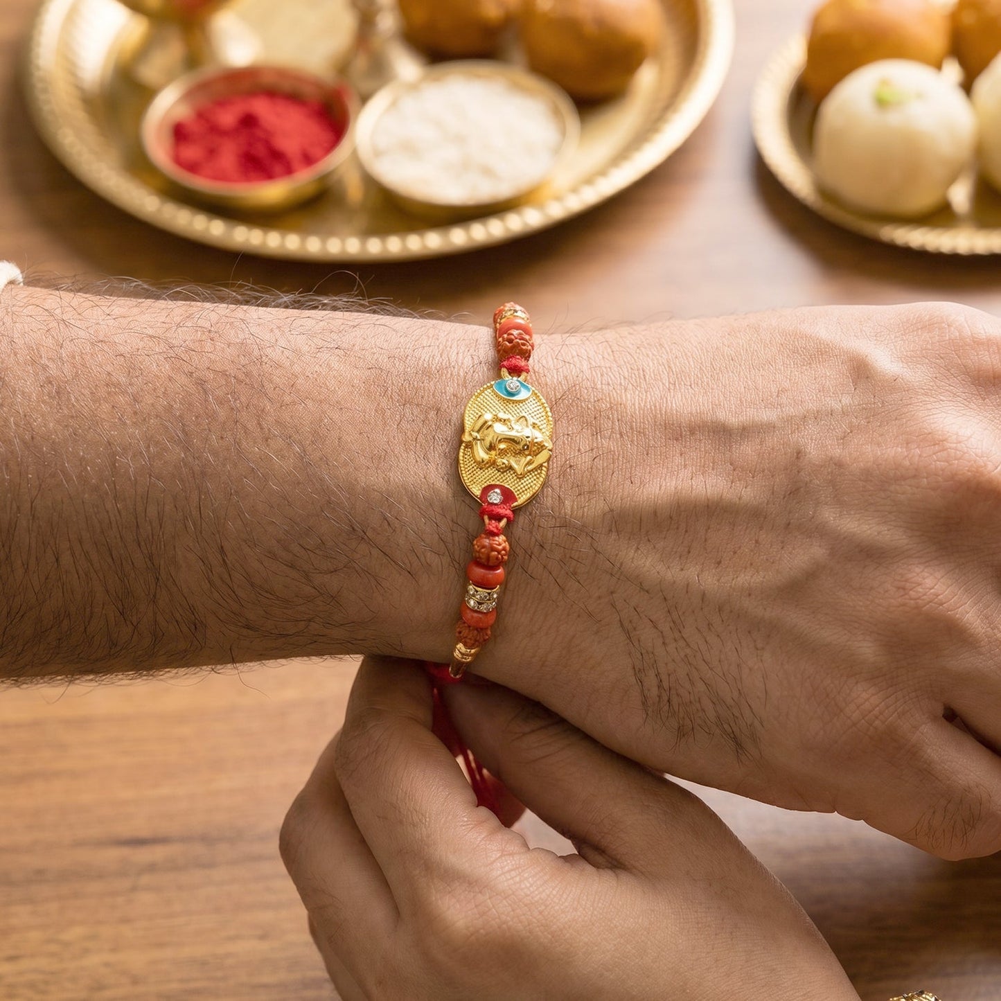 Side view of Ganesh Design Rakhi with beadwork detail