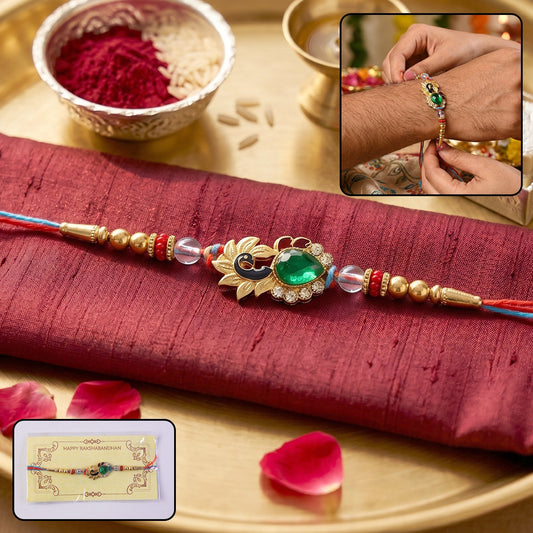 Silver Peacock Design Rakhi with Red Thread – Front View