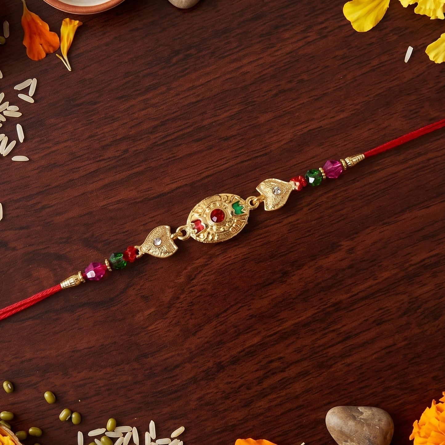 Side angle of gold stone rakhi with beads