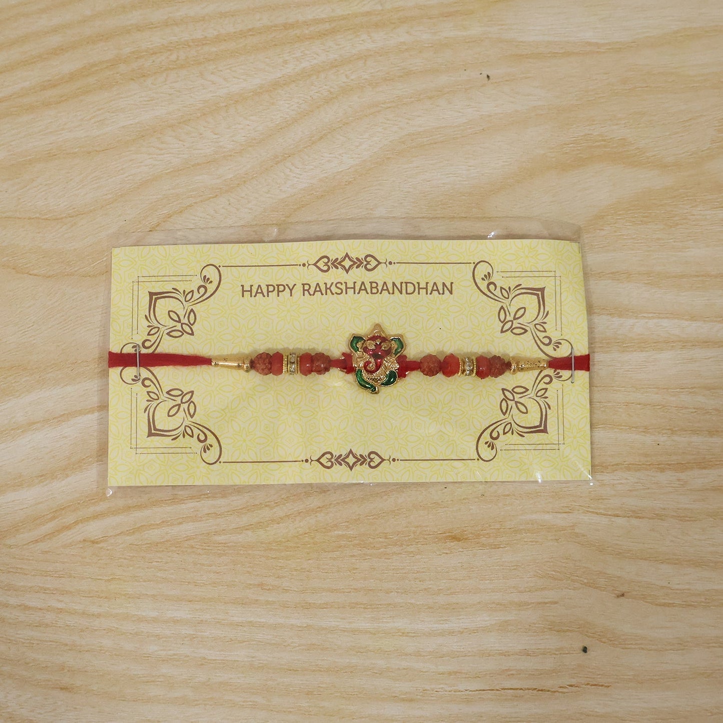 Ganesh Designer Rakhi with Rudraksha beads close-up detail