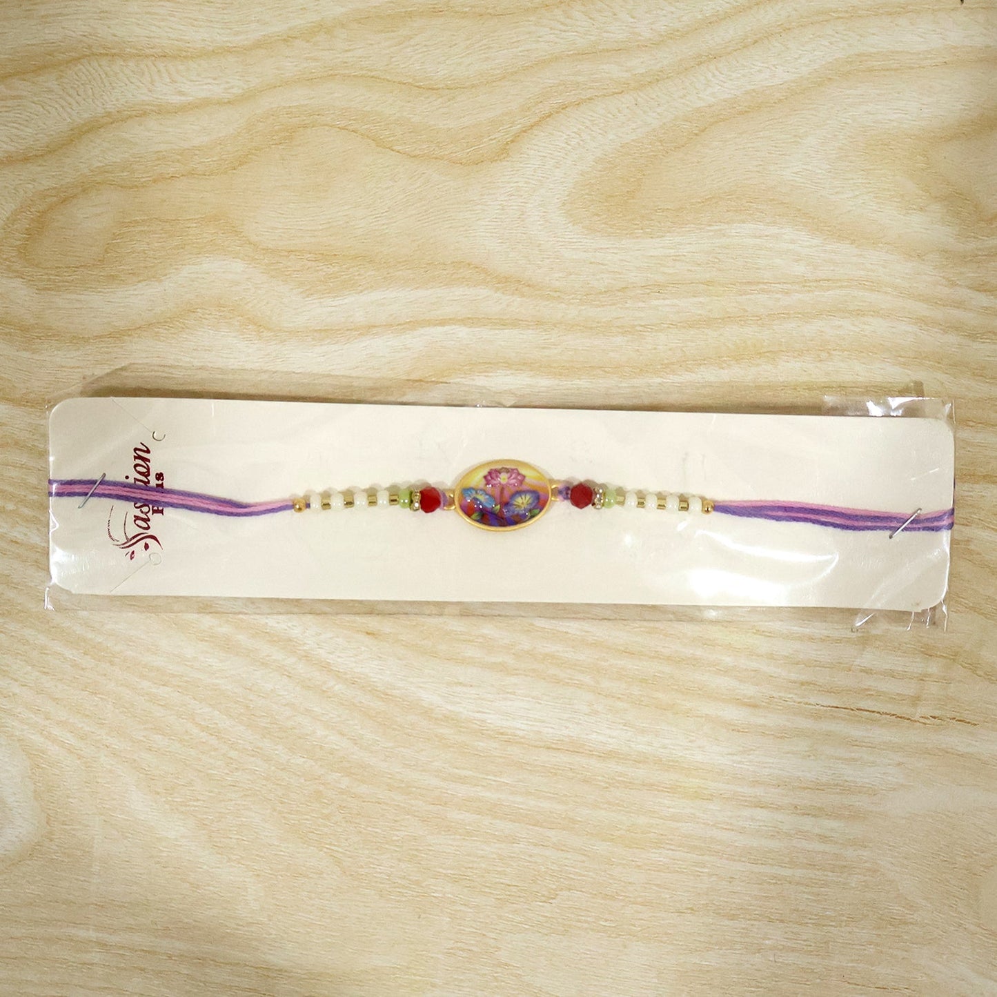 Top angle of floral Rakhi highlighting intricate details