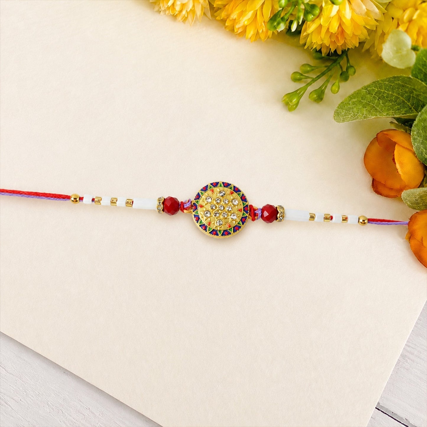 Rakhi tied style with white beads and round stone centerpiece